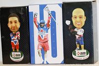 Two Toronto Rock lacrosse bobbleheads on bases in boxes, showing detailed faces and team uniforms
