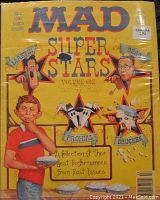 Photo of the Fall 1985 Mad Super Stars Volume One special edition with cartoon caricatures of Martin, Prohias, Berg, Drucker on yellow cover.