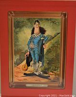 Front cover detail showing a framed caricature titled 'The Blue Boy' painted in vibrant colors, mounted on a red background.