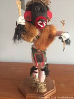 Full view of the Hopi Kachina carving 'Ogres Man' displaying the figure standing upright with detailed clothing and weaponry.