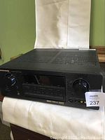 Front view of the Marantz SR7400 AV surround receiver showing power button, selector and volume knobs, headphone jack, and input buttons