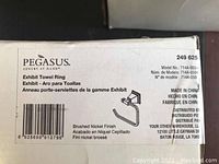 Close-up photo of the packaging box for the Pegasus Exhibit towel ring, showing the model number 714A-050 and brushed nickel finish.