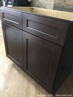 Assembled cabinet example showing Shaker-style flat panel doors and drawers in espresso finish