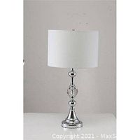 Chrome table lamp with crystal accent, white shade on a neutral background
