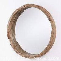 Round mirror with carved wooden frame against white background