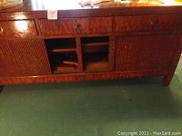 Dark wood console with three drawers on top and two textured doors on bottom with an open middle section showing a shelf inside. Doors are inoperable and need replacement.