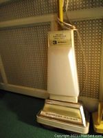 View of the Kenmore floor shampoo and polisher featuring the 3-speed control panel and branding on scrubber head.