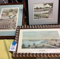 Photo showing three framed vintage photographic prints from Stockton 1855, including harbor and agricultural scenes.
