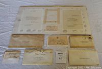 Image of signed letters and postmarked envelopes related to Presidents Truman, Eisenhower, and Hoover arranged on white surface.