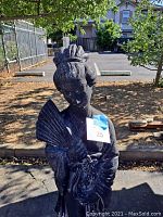 Concrete Geisha woman garden statue holding a fan with detailed facial features and traditional kimono.
