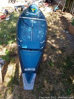 Overhead interior view of canoe showing bench seats and hull condition