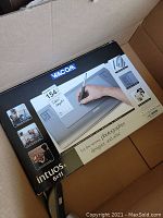 Photo of Wacom Intuos3 tablet box with brand and product name visible inside a cardboard box