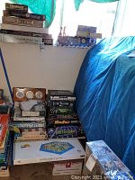 Stack of boxed adventure and role-playing board games on riser