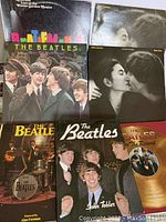 Photo showing 3 vintage Beatles books and 4 albums including Double Fantasy and Beatlemania