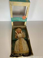 Vintage GE Heavenly Angel Christmas decoration inside original box showing figurine lying down in box with visible angel details and box design