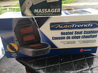Boxed Auto Trends Heated Seat Cushion showing product image and features.