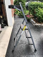 Side view of the 4 foot folding ladder showing steel frame and steps