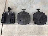 Top view of the Canon down-rigger base and two swivel mounts showing surface texture and mounting knobs