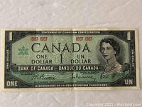 Front of the 1967 Canadian Centennial one dollar bill showing Queen Elizabeth II, denomination, and centennial text.