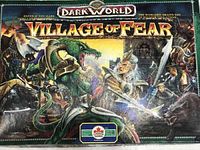 Box top showing Dark World Village of Fear fantasy artwork depicting a battle with a dragon and warriors.