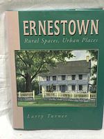 Front cover of book 'Ernestown: Rural Spaces, Urban Places' showing a traditional building illustration with the author's name Larry Turner.