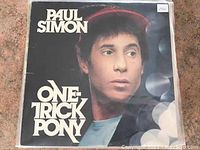 Front cover of Paul Simon One Trick Pony LP in sleeve