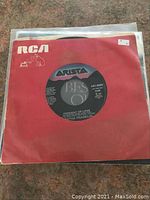 Top vinyl record Aretha Franklin 'Freeway of Love' with Arista label in red RCA paper sleeve.