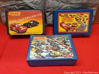 Three vintage Matchbox Official Collectors Carry Cases with distinct colorful labels, shown whole