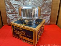 Full view of the cake stand with aluminum dome and glass plate on original box showing brand and product name