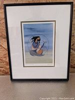 Framed signed print of 'Spirit of the Winds' by Maxine Noel, showing entire artwork with white matte and thin dark frame.