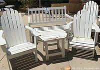 Front view showing two white adult Adirondack chairs, white 2-seater bench, and small table