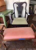 Wooden armchair with green velvet cushion and wooden bench with pink velvet upholstery, showing overall condition and fabric detail.