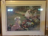 Framed offset lithograph by Gertenbach depicting a woman and child in a garden with flowers