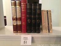 Photo showing full set of vintage books including Funk & Wagnalls dictionaries, The New Popular History of the World, Harvard Classics editions, and Dr Who paperbacks.