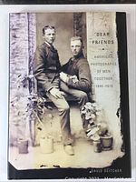 Front cover of 'Dear Friends' book showing vintage photo of two men sitting and standing together.
