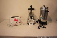 Photo showing all three appliances: Little Kitty Toast Maker, Back to Basics Smoothie Elite blender, and Regal 30-cup coffee pot