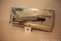Front view of the sealed box showing the Space Shuttle Columbia image, NASA logo, and model kit details.