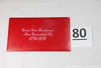 Closed red folder labeled United States Bicentennial Silver Uncirculated Set 1776-1976
