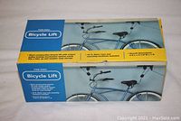 Boxed Harbor Freight Tools bicycle lift showing product image and features on packaging.