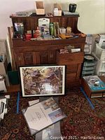 Overview of lot showing wooden desk organizer, framed puzzle, blank DVDs, and various small items