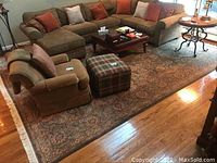 Full view of area rug under living room furniture