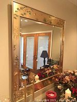 Full view of the mirror mounted on wall showing overall design and frame