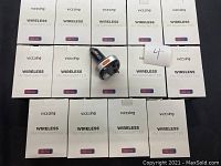 Fourteen boxed VicTsing wireless FM transmitters with one transmitter outside the box showing the design and size.