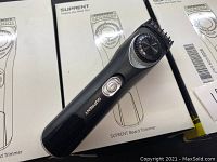 Photo showing three SupRent beard trimmers on their retail packaging boxes. Trimmers are black with a rotary adjustment dial for trimming length, each with an on/off switch and visible trimming guards attached.