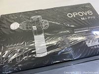 Box front showing Opove M3 Pro percussion massage gun with interchangeable applicators illustration and product name.