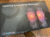 Box of the HailiCare Heating Knee Wrap Massager showing branding and product image