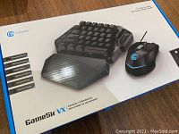 Box of GameSir VX Gaming Keypad and Mouse showing product image and brand details.