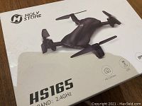 White retail packaging box labeled Holy Stone HS165 2.4GHz with drone graphic