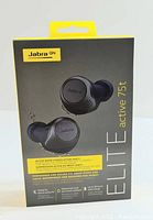 Photo of Jabra GN Elite Active 75t earbuds packaging detailing product features like active noise cancellation, waterproof and dust resistant properties, and battery life up to 28 hours.