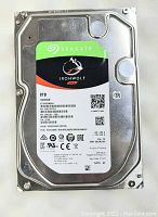Front view of Seagate IronWolf NAS 8TB hard drive with label and branding clearly visible.